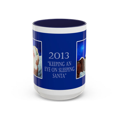 2013 KEEPING AN EYE ON SLEEPING SANTA (Ceramic Mug)